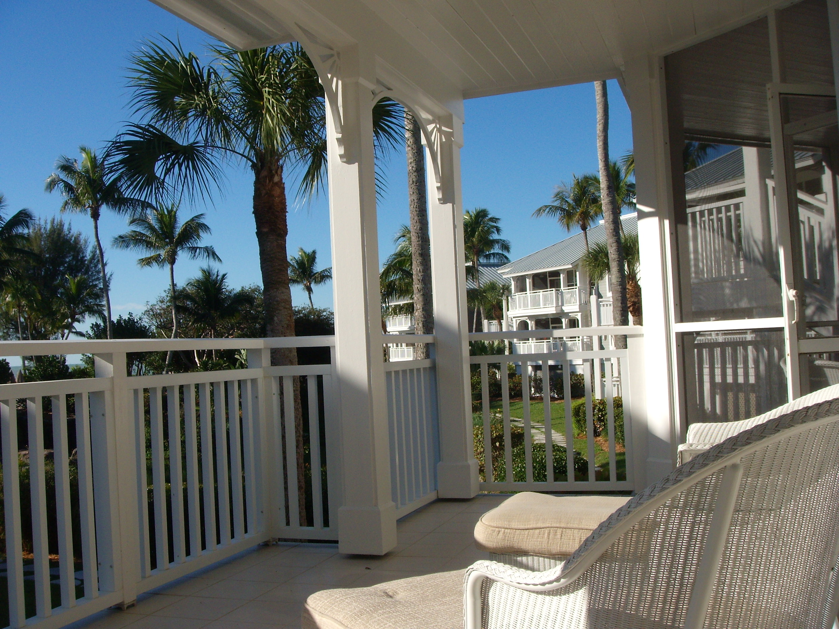 Screened cottage porch at Sanibel Cottages Resort